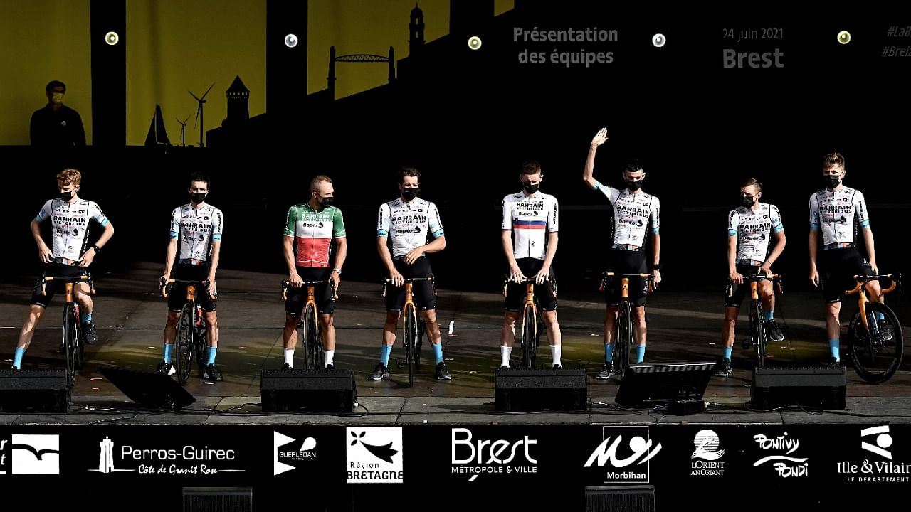 In this file photograph taken on June 24, 2021, Team Bahrain's riders attend the team's presentation two days ahead of the first stage of the 108th edition of the Tour de France cycling race, near Brest, western France. Credit: AFP Photo