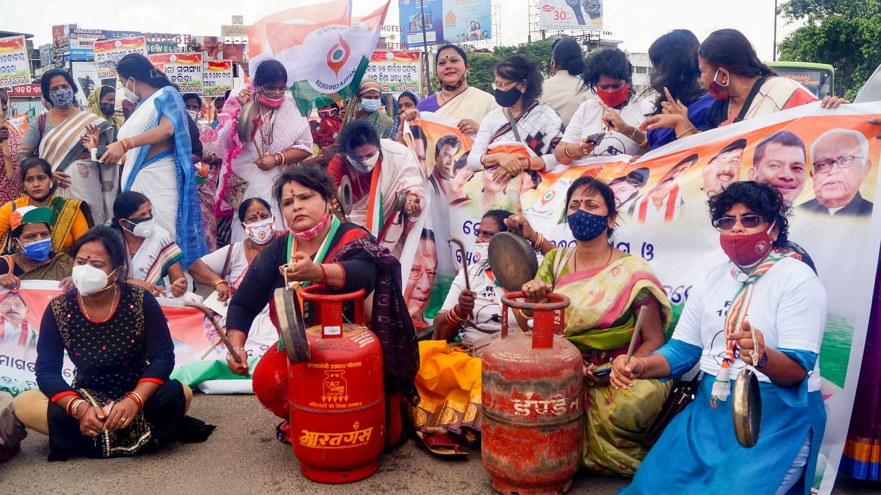 Congress Party Mahila Morcha workers stage a protest against hike in the LPG and fuel prices in Bhubaneswar, Wednesday, July 14, 2021. Credit: PTI Photo