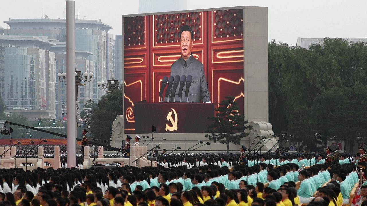 Chinese President Xi Jinping is seen on a giant screen as he delivers a speech at the event marking the 100th founding anniversary of the Communist Party of China. Credit: Reuters File Photo