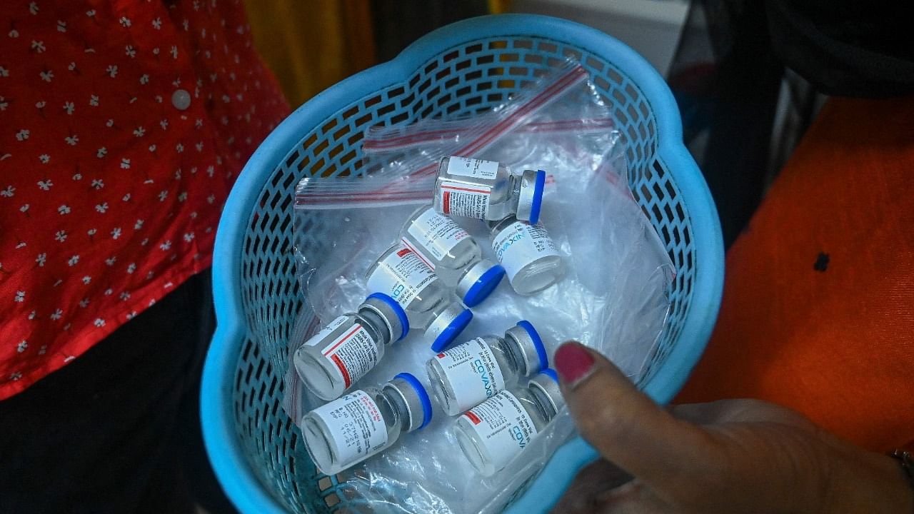 A health worker carries vials of the Covaxin vaccine against the Covid-19 coronavirus at a health centre in New Dehi on July 15, 2021. Credit: AFP Photo