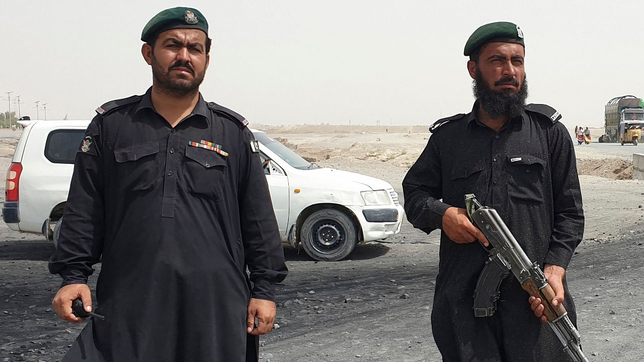 Frontier constabulary personnel stand guard in the border town of Chaman on July 16, 2021, following clashes between Afghan forces and Taliban fighters in Spin Boldak to retake the key border crossing with Pakistan. Credit: AFP Photo
