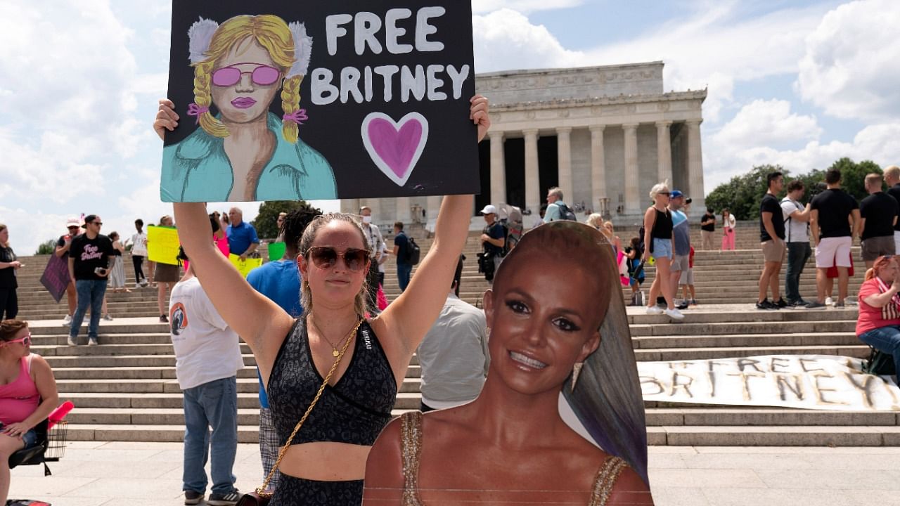 Maggie Howell supporter of pop star Britney Spears protests next to a Britney Spears cardboard cutout at the Lincoln Memorial, during the "Free Britney" rally, Wednesdays, July 14, 2021, in Washington. Credit: AP Photo