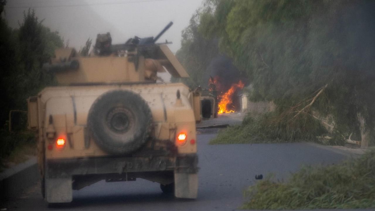 Humvees that belong to Afghan Special Forces are seen destroyed during heavy clashes with Taliban during the rescue mission of a police officer besieged at a check post, in Kandahar province. Credit: Reuters Photo