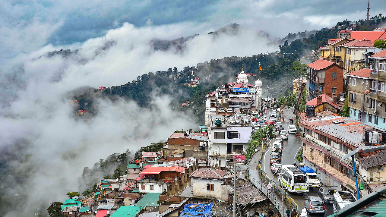 Clouds engulfs the city following heavy rain in Shimla. Credit: PTI File Photo