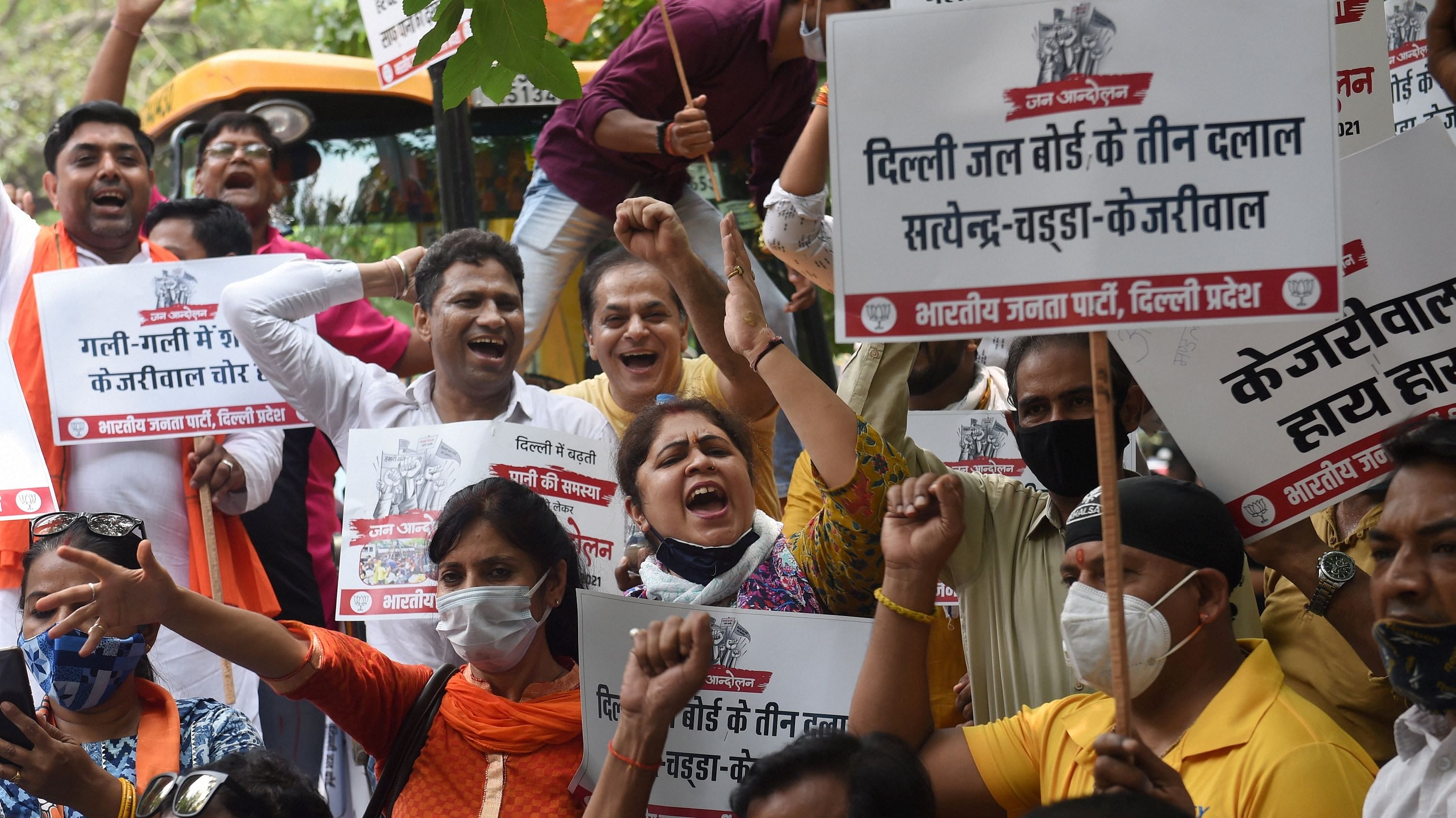 BJP workers during a protest over water crisis and an alleged scam, outside Delhi Jal Board Chairman Satyendar Jain's residence in New Delhi. Credit: PTI Photo