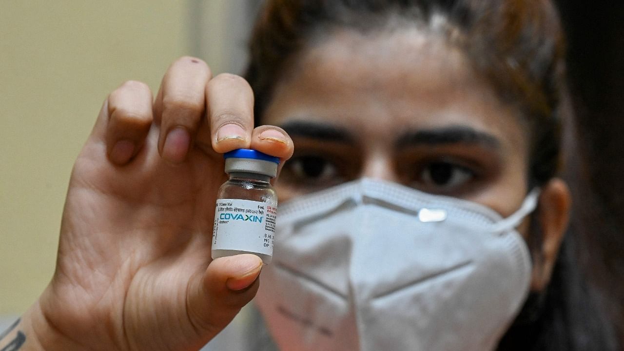 A health worker displays a vial of the Covaxin vaccine against the Covid-19 coronavirus at a health centre in New Dehi on July 15, 2021. Credit: AFP Photo