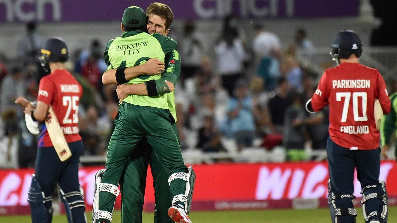 Pakistan's Shaheen Shah Afridi hugs wicketkeeper Mohammad Rizwan to celebrate their win in the first Twenty20 international between England and Pakistan at Trent Bridge in Nottingham. Credit: AP/PTI Photo