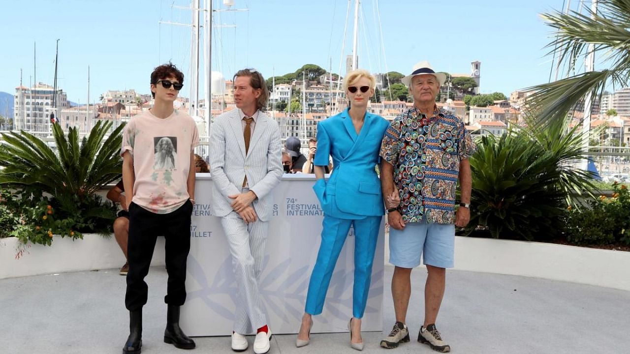 French-US actor Timothee Chalamet, US director Wes Anderson, British actress Tilda Swinton and US actor Bill Murray pose during a photocall for the film "The French Dispatch" at the 74th edition of the Cannes Film Festival. 