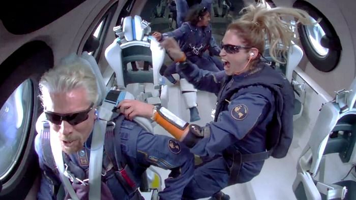 Billionaire Richard Branson speaks as crew members float in zero gravity above Spaceport America. Credit: Reuters Photo