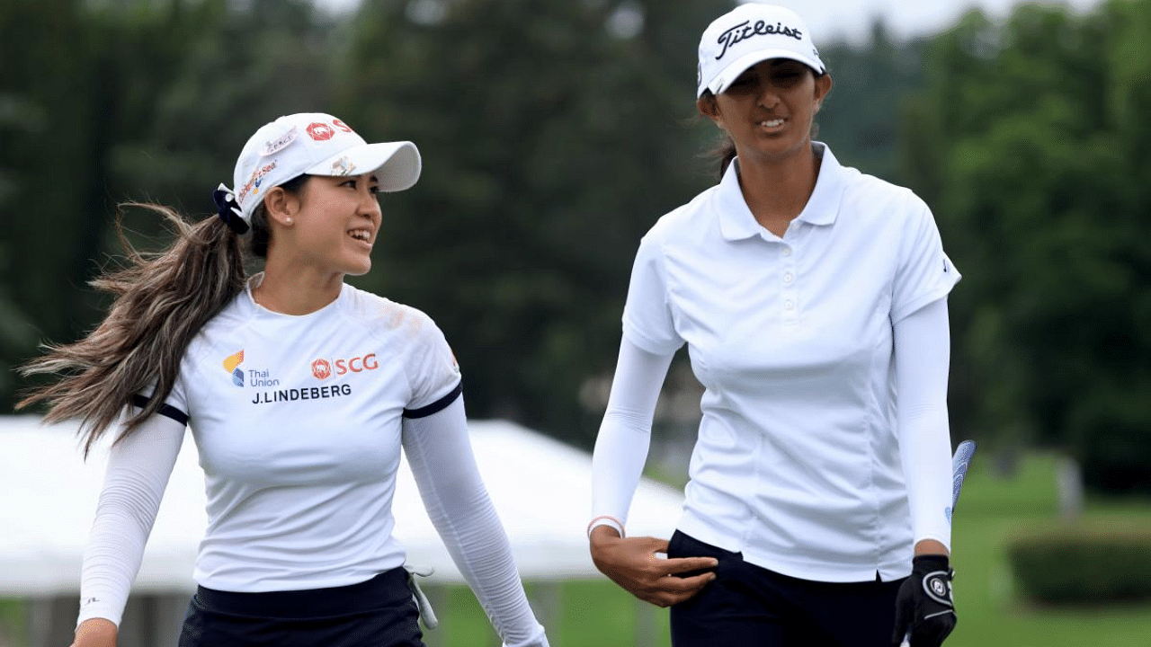 Pajaree Anannarukarn (L) and Aditi Ashok of India walk off the 15th hole during the third round of the Dow Great Lakes Bay Invitational at Midland Country Club. Credit: AFP Photo