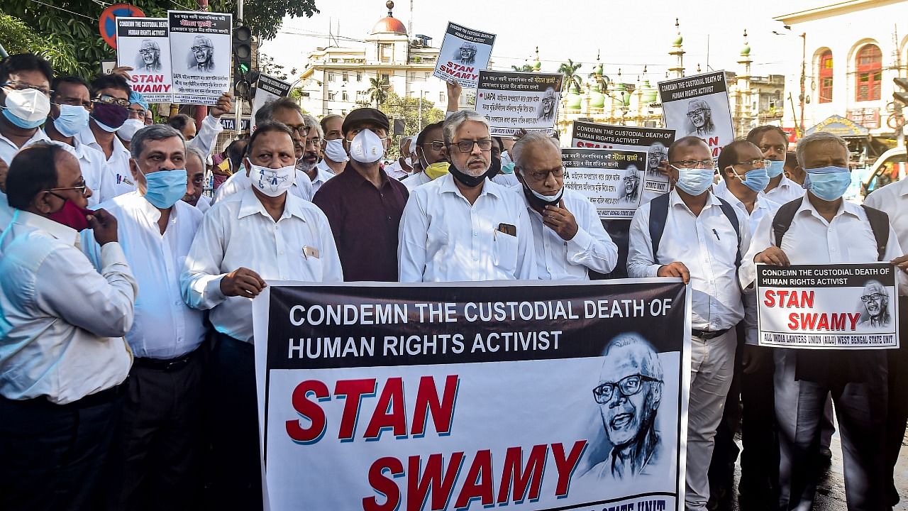 Lawyers of All India Lawyers Unit(AILU) during an agitation to condemn the custodial death of civil rights activist Father Stan Swami, in Kolkata, Tuesday, July 13, 2021. Credit: PTI Photo