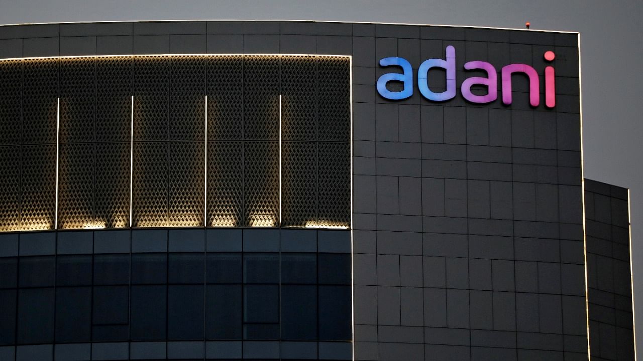 he logo of the Adani Group is seen on the facade of one of its buildings on the outskirts of Ahmedabad. Credit: Reuters File Photo
