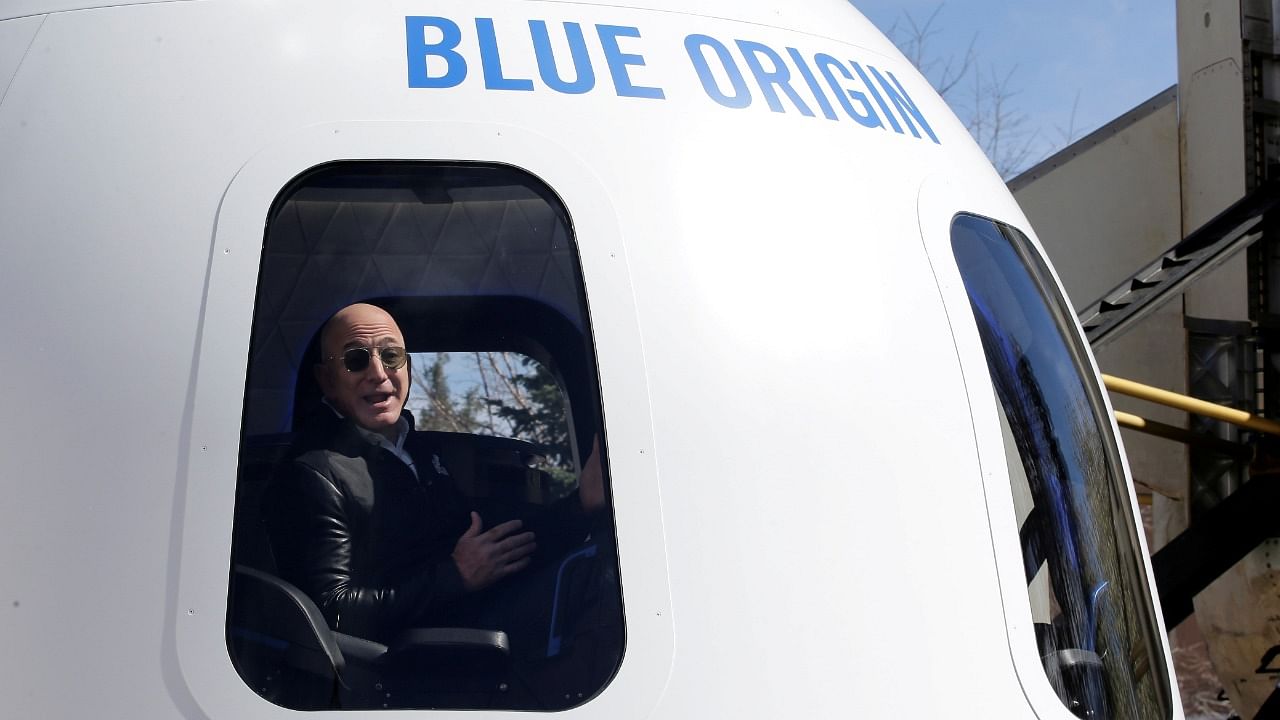 Amazon and Blue Origin founder Jeff Bezos addresses the media about the New Shepard rocket booster and Crew Capsule mockup at the 33rd Space Symposium in Colorado Springs. Credit: Reuters Photo
