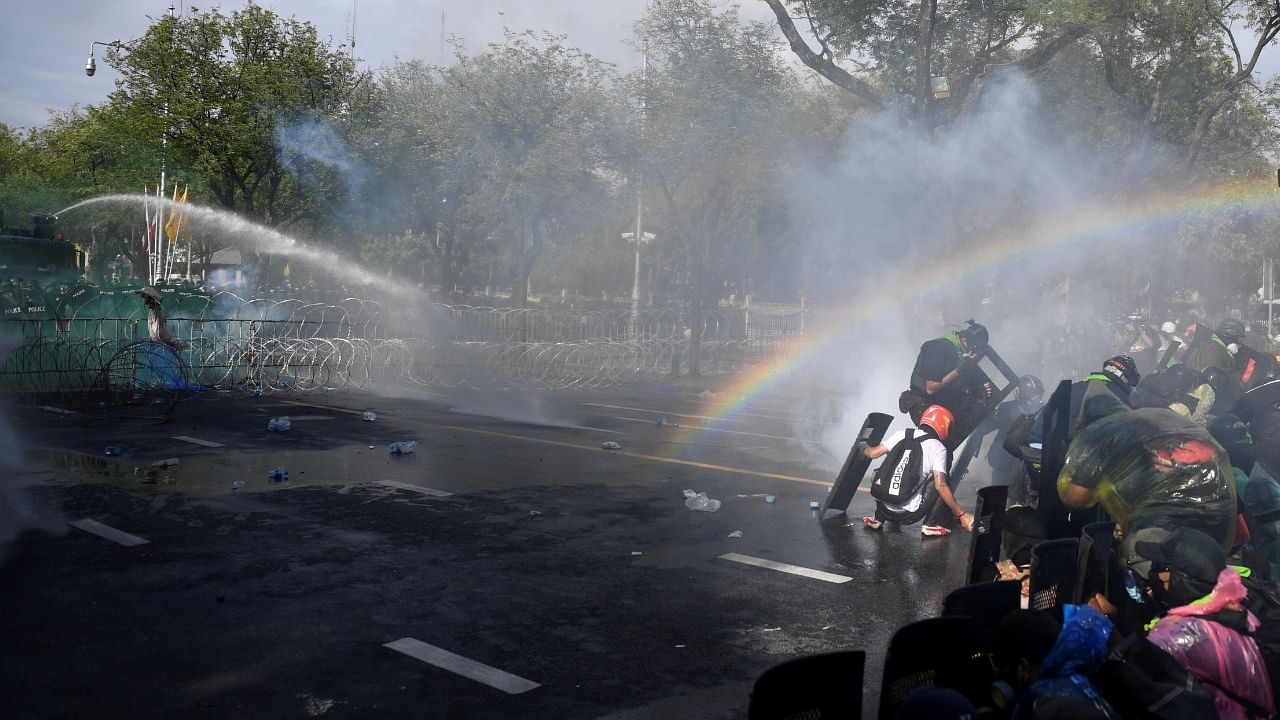 By late afternoon, the two sides were standing off as clouds of gas rose in the air. Credit: Reuters Photo