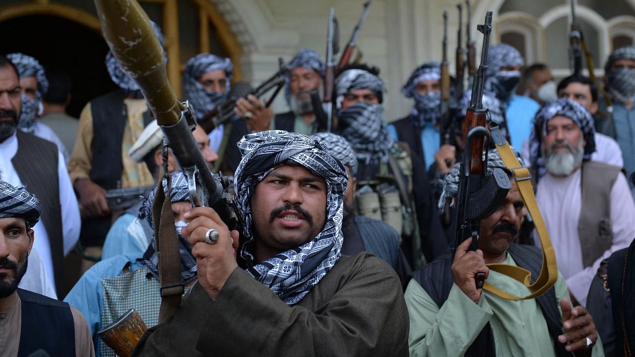 Afghan militia gather with their weapons to support Afghanistan security forces against the Taliban in Herat. Credit: AFP File Photo
