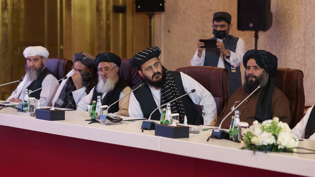 A delgation of the Taliban attends a session of the peace talks with the Afghan government in Doha. Credit: AFP Photo