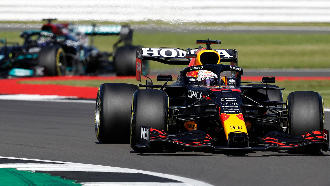 Red Bull's Dutch driver Max Verstappen (R) leads Mercedes' British driver Lewis Hamilton. Credit: AFP Photo