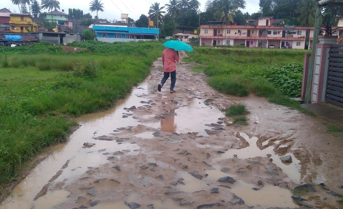 A pothole-ridden road leading to Mukunda Layout in Gonikoppa.