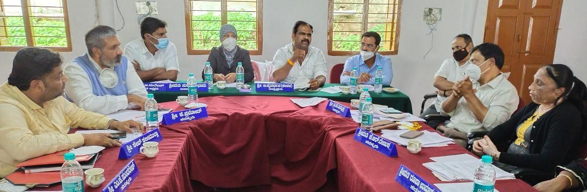 Town Panchayat president B Jaivardhan chairs a meeting in Kushalnagar.