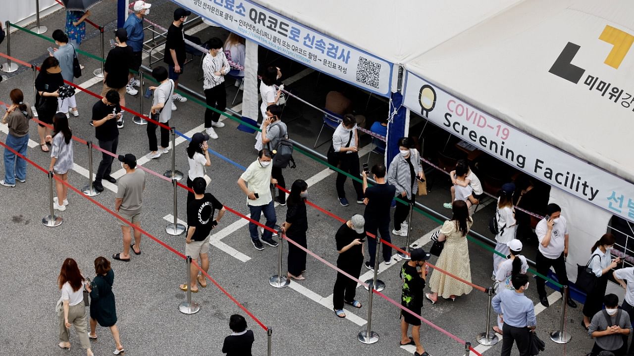 People wait in line for a coronavirus test at a testing site which is temporarily set up at a public health centre in Seoul, South Korea. Credit: Reuters Photo