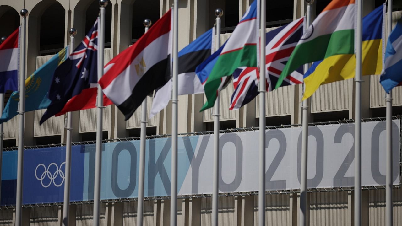 Tokyo 2020 Olympics signage is seen behind nations flags at the Ariake Tennis Park. Credit: Reuters Photo