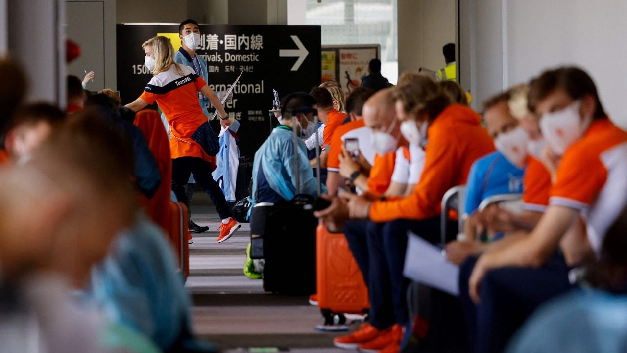 Members of the Netherlands delegation wait for screening and Covid testing upon their arrival on a flight from Amsterdam at Narita International Airport in Narita, Chiba Prefecture on July 18, 2021, ahead of the 2020 Olympic Games in Tokyo. Credit: AFP Photo