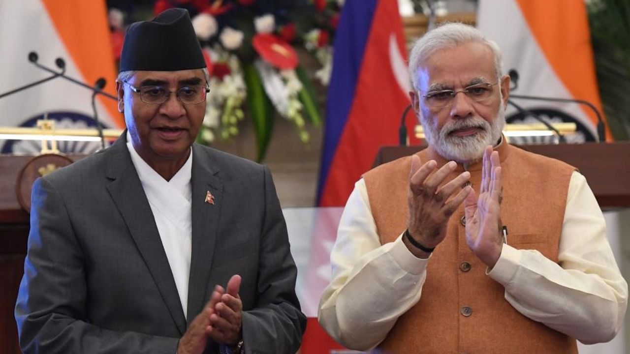 Indian Prime Minister Narendra Modi (R) and Nepali Prime Minister Sher Bahadur Deuba file photo. Credit: AFP Photo