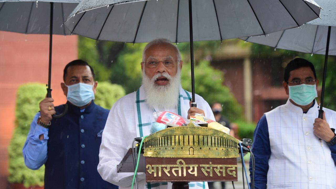 Prime Minister Narendra Modi addresses the media, as it rains on the first day of the Monsoon Session of Parliament, in New Delhi, Monday, July 19, 2021. Credit: PTI Photo