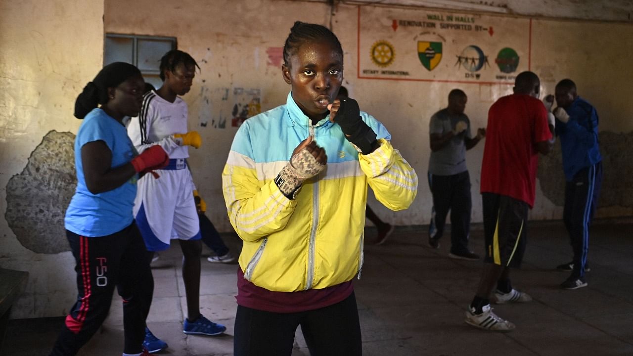 Emily Juma (C) and other members of Boxgirls Kenya participate in a boxing traning session. Credit: AFP Photo
