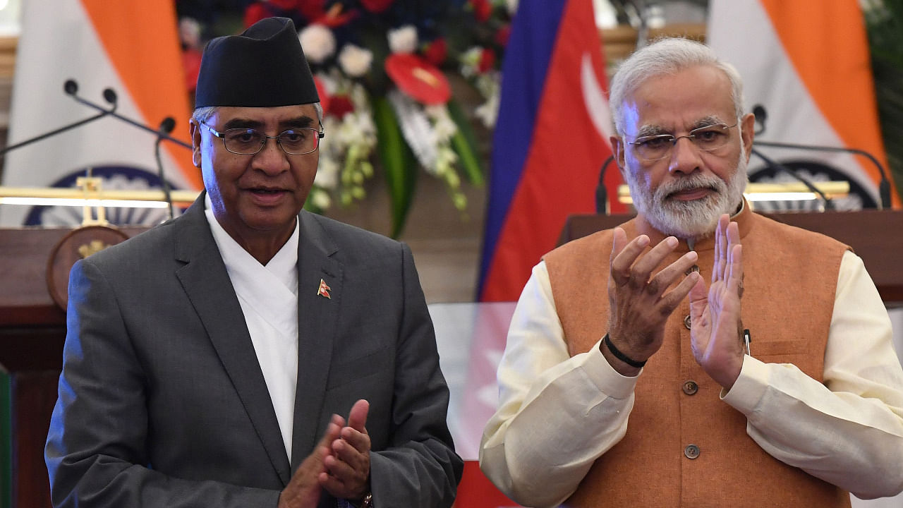 Indian Prime Minister Narendra Modi (R) and Nepali Prime Minister Sher Bahadur Deuba. Credit: AFP Photo