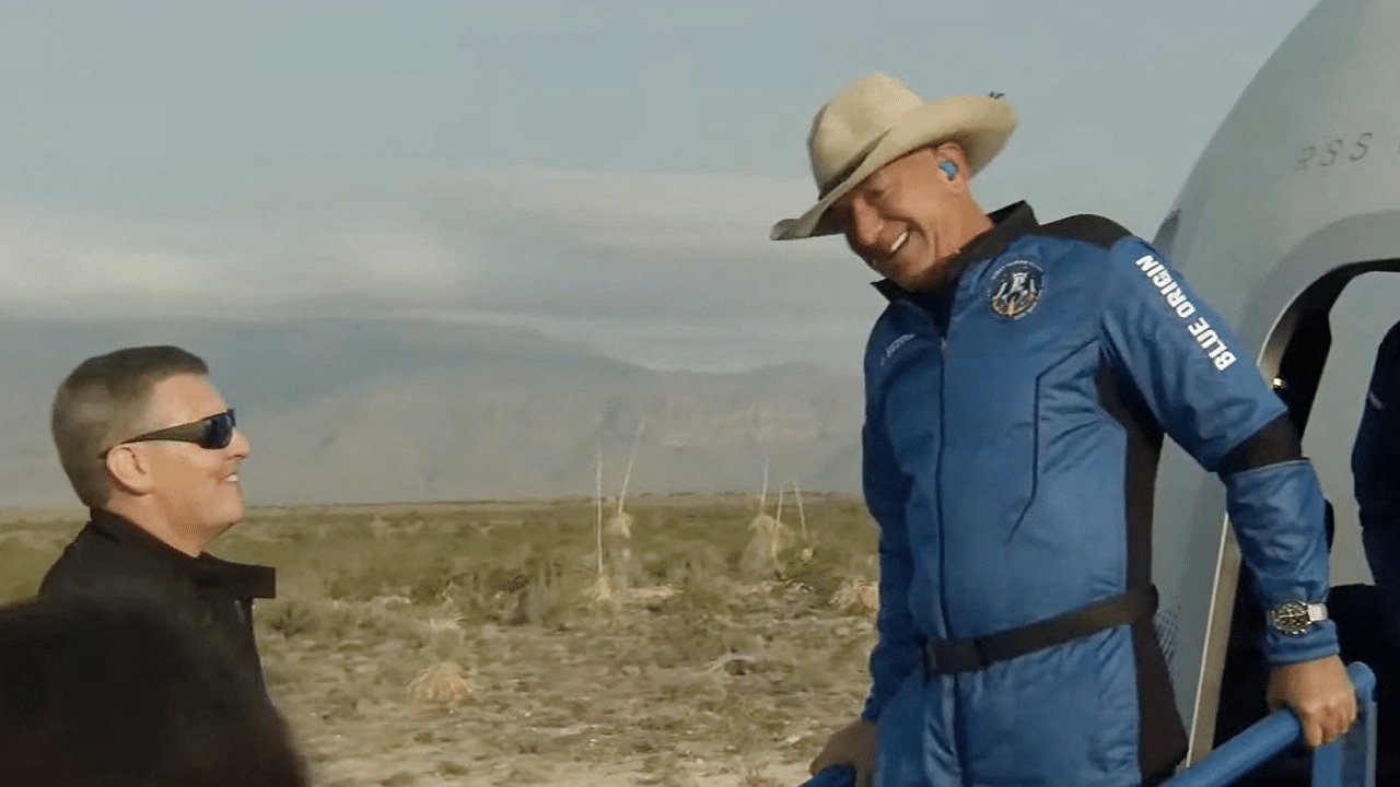 Jeff Bezos after Blue Origin's reusable New Shepard craft capsule returned from space, safely landing. Credit: AFP Photo