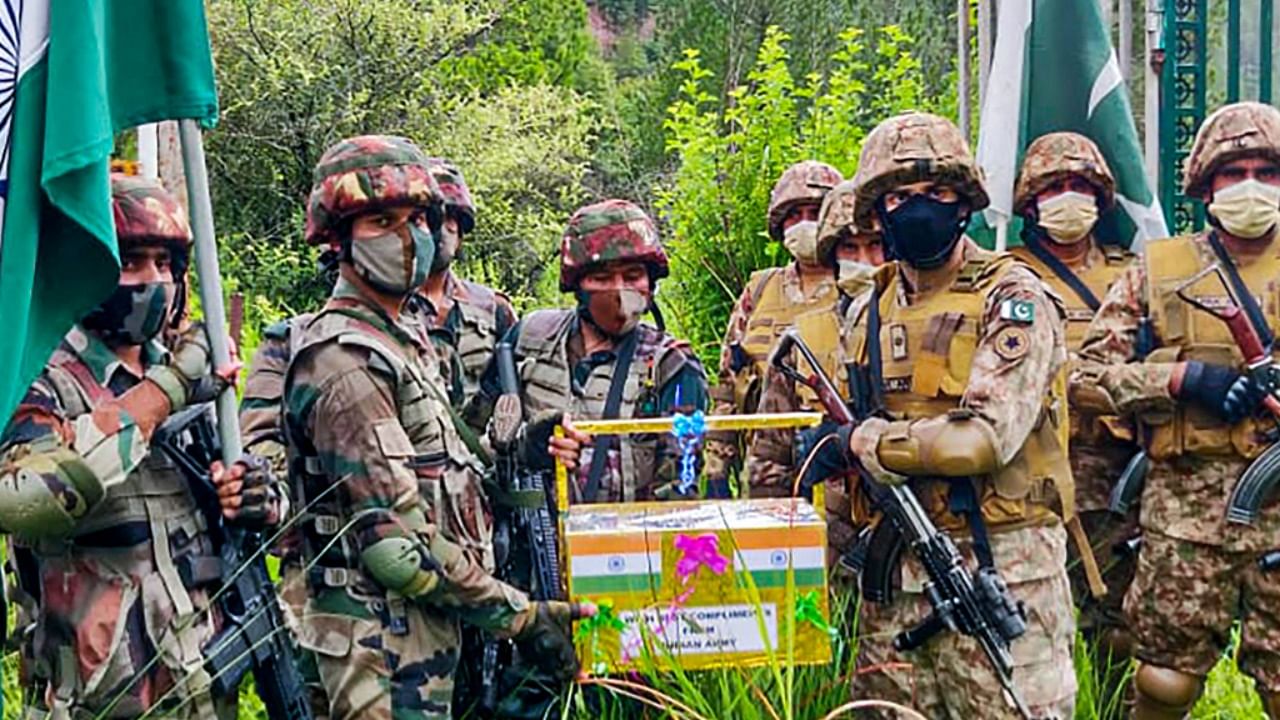Indian & Pakistani Army exchange sweets on the occasion of Eid al-Adha at the Line of Control at Poonch-Rawalakot Crossing Point. Credit: PTI Photo