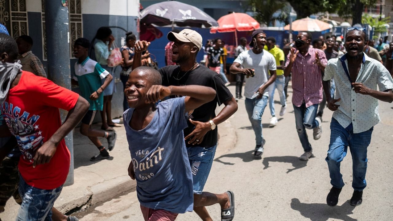 Supporters of Haiti's slain President Moise protest against presence of Haiti's National Police chief Charles in Cap-Haitien. Credit: Reuters Photo