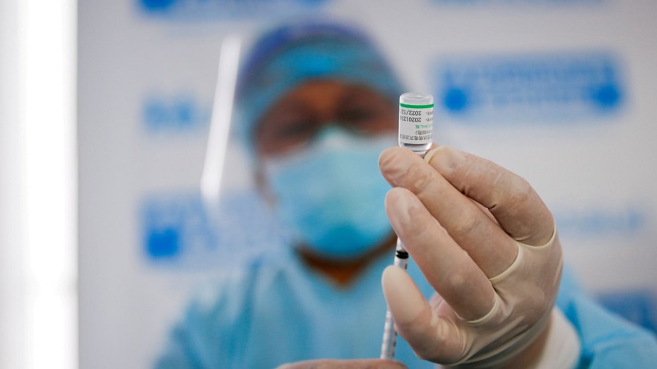 A health worker prepares a dose of the Sinopharm vaccine. Credit: Reuters Photo