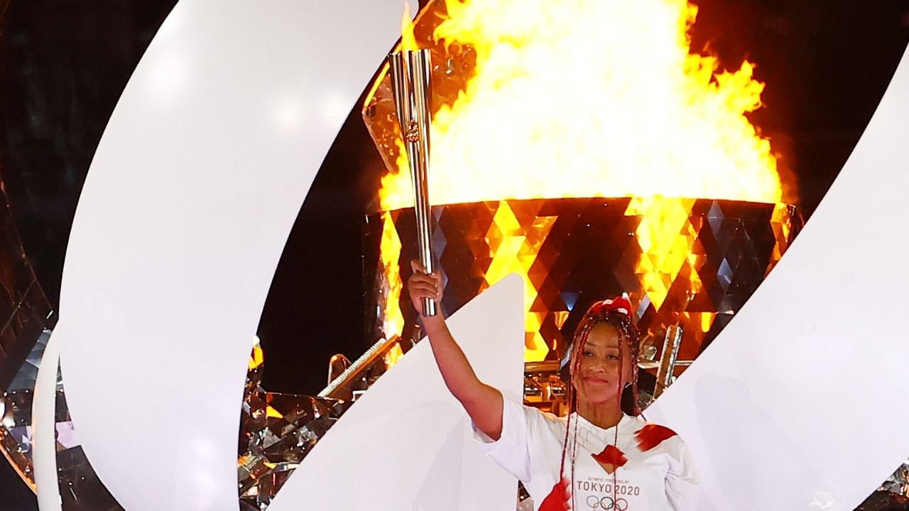 Osaka lifted the torch to the gleaming cauldron. Crediit: Reuters Photo