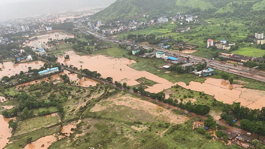 this handout photo taken on July 23, 2021, by the Indian Navy shows areas inundated with flood water after heavy monsoon rains in Raigad district of Maharashtra