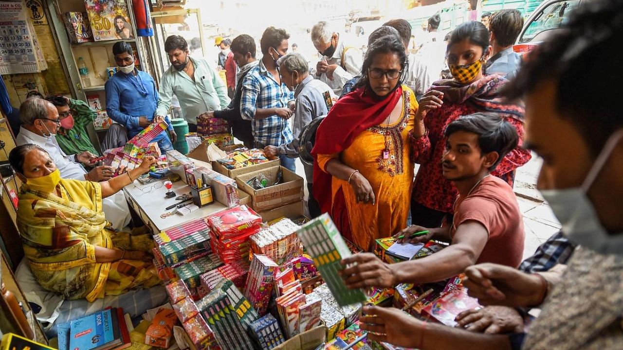 People visit a firecrackers' shop, ahead of the Diwali festival, near Jama Masjid in old Delhi. Credit: PTI File Photo
