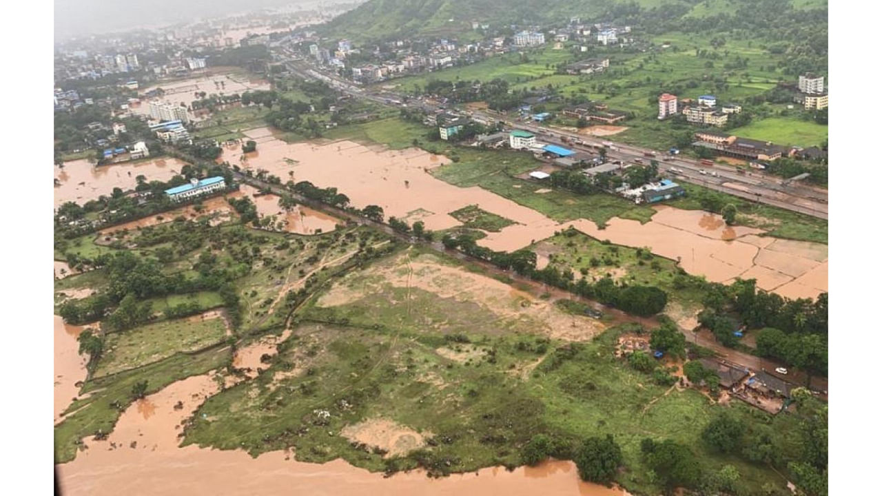  In this handout photo taken on July 23, 2021, by the Indian Navy shows areas inundated with flood water after heavy monsoon rains in Raigad district of Maharashtra. Credit: AFP Photo