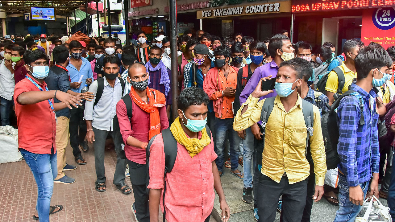 Passengers arrive at Sangoli Rayanna railway station during Covid-induced lockdown, in Bengaluru. Credit: PTI Photo