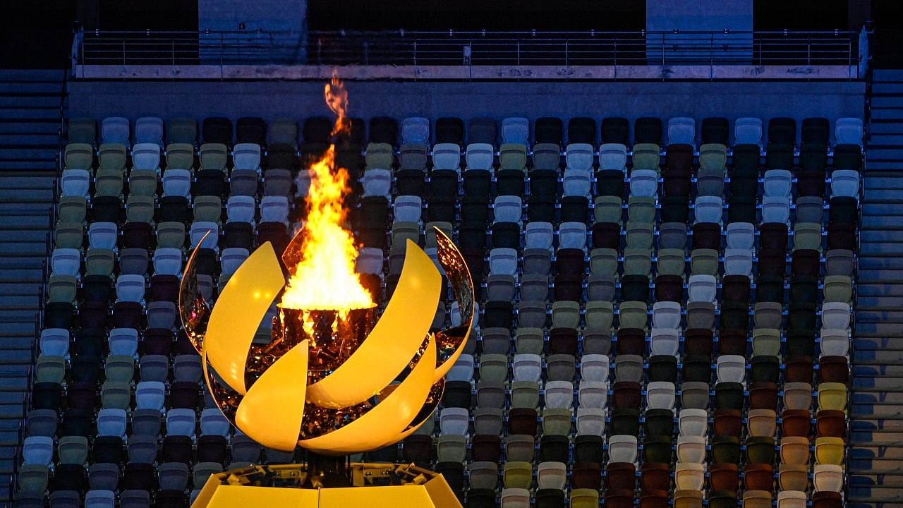 The Olympic flame lit at the Olympics Stadium, during the opening ceremony of the Summer Olympics 2020, in Tokyo. Credit: AP/PTI Photo