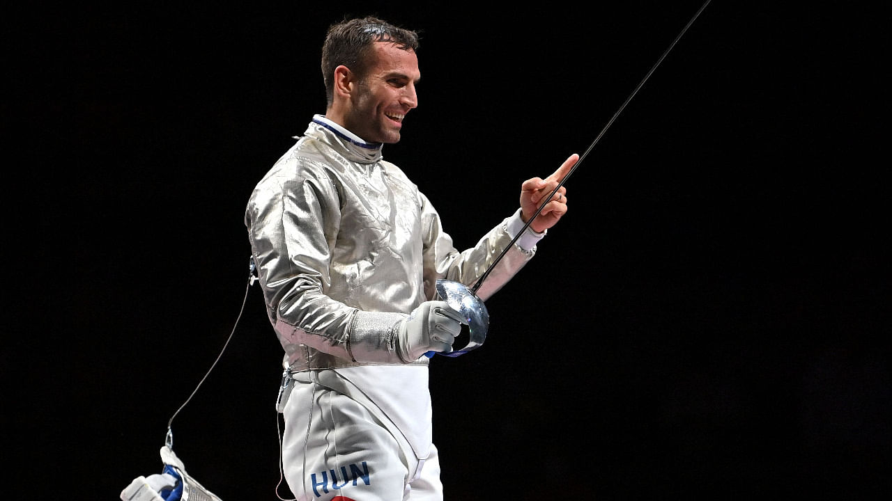 Hungary's Aron Szilagyi celebrates after winning in the men's sabre individual gold medal bout during the Tokyo 2020 Olympic Games. Credit: AFP Photo
