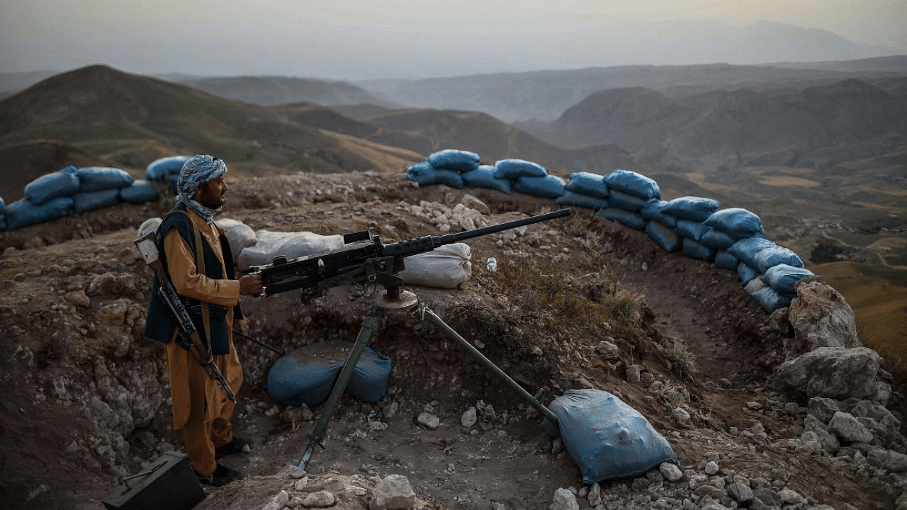 Afghan militia fighter keeps a watch at an outpost against Taliban insurgents at Charkint district in Balkh Province. Credit: AFP Photo