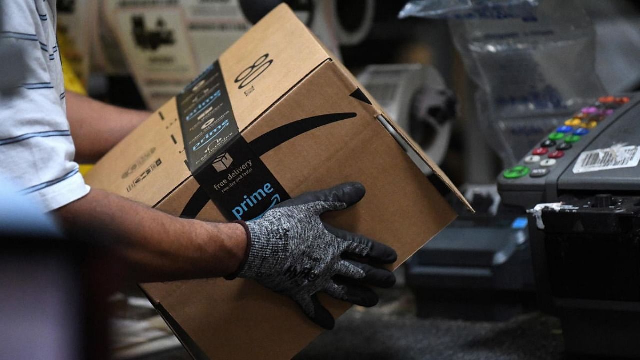 Worker assembles a box for delivery at the Amazon fulfilment center in Baltimore. Credit: Reuters Photo