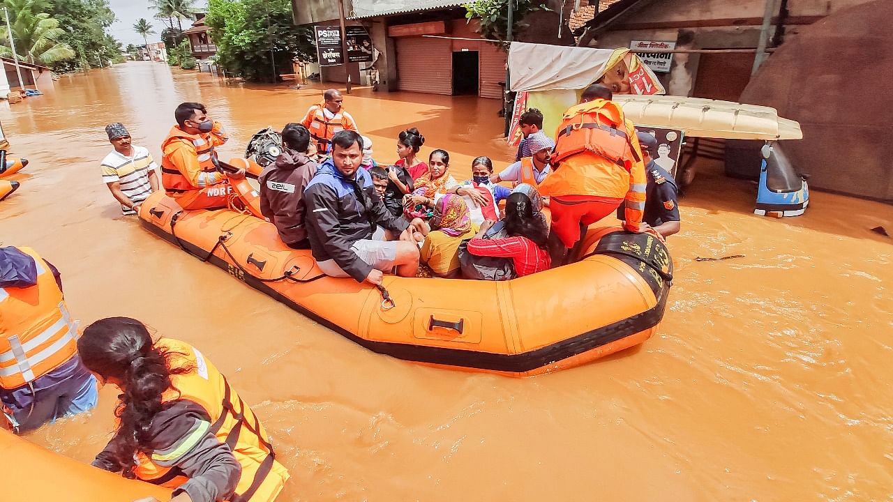 Rescue operation being carried out at a flood affected area in Kohlapur district. Credit: PTI Photo