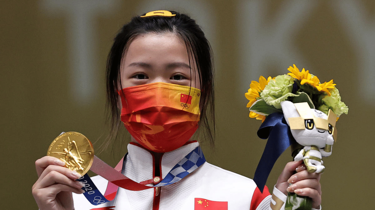 Gold medallist Yang Qian of China celebrates on the podium. Credit: Reuters Photo