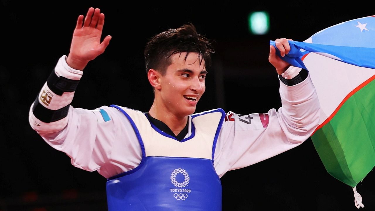 Rashitov of Uzbekistan celebrates winning gold. Credit: Reuters Photo