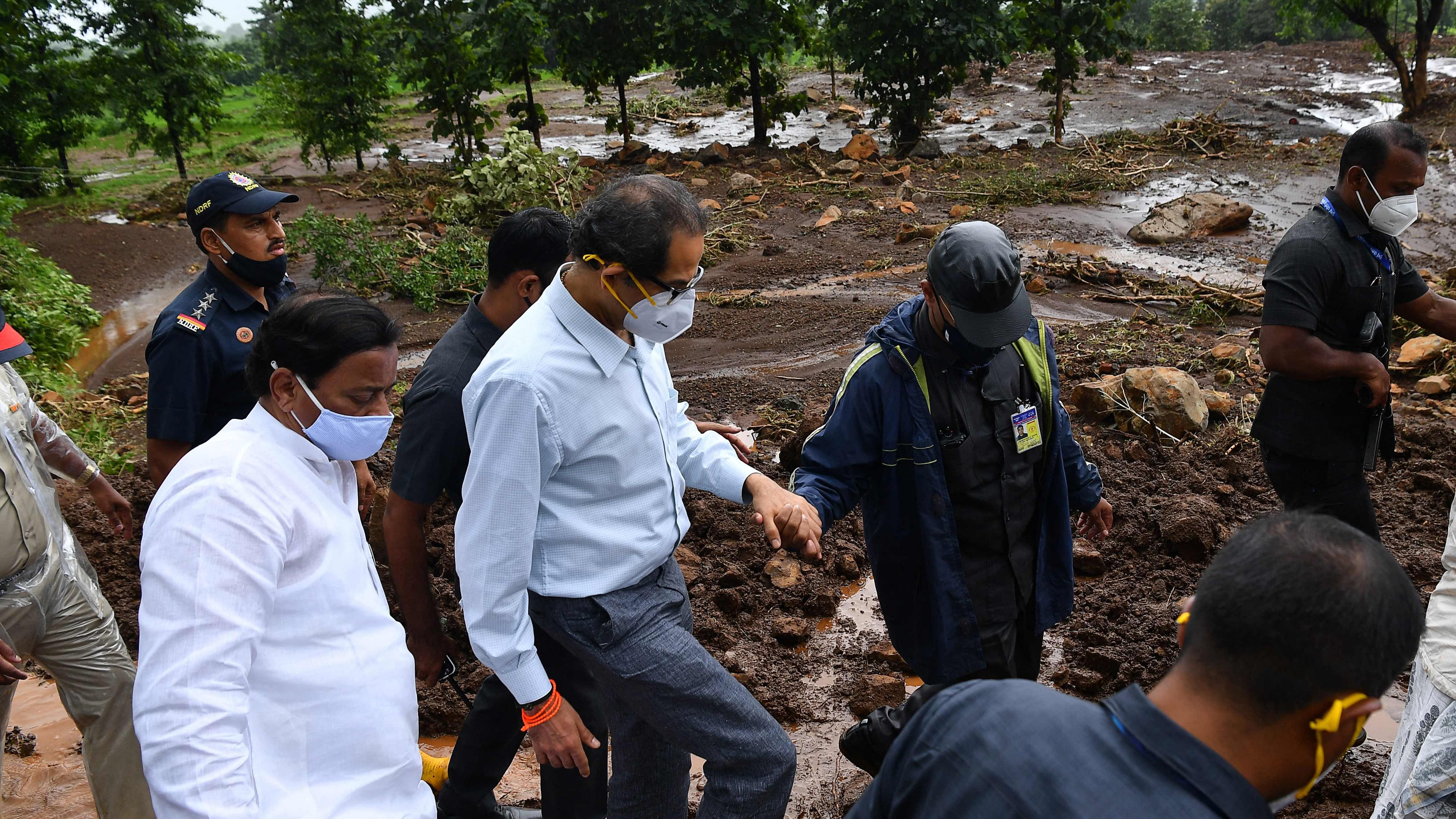 ndia's Chief Minister of Maharashtra Uddhav Thackeray (2L) visits along with officials the site of a landslide at Taliye, about 22 km from Mahad city. Credit: AFP