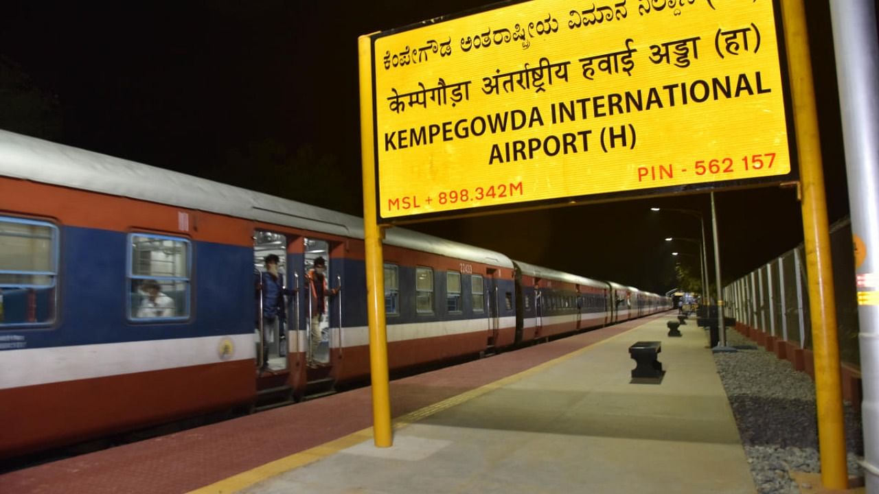 The train comes from Bangarpet chugs and leaves towards city at the Kempegowda International Airport (H) after inauguration of new railway station in Bengaluru. Credit: DH Photo