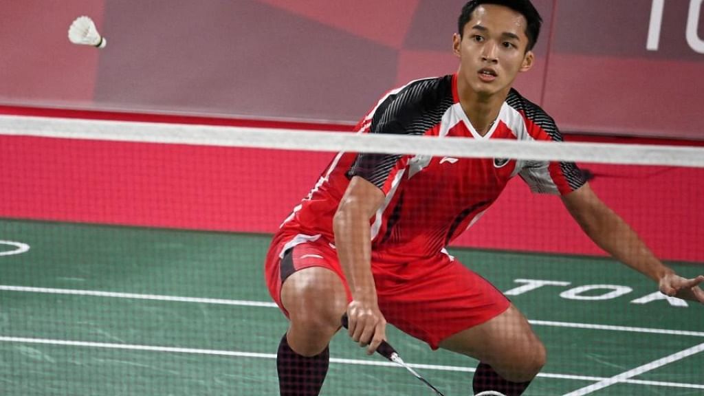 Jonatan Christie hits a shot in his men's singles badminton group stage match against Refugee Olympic Team's Aram Mahmoud during the Tokyo 2020 Olympic Games. Credit: AFP Photo