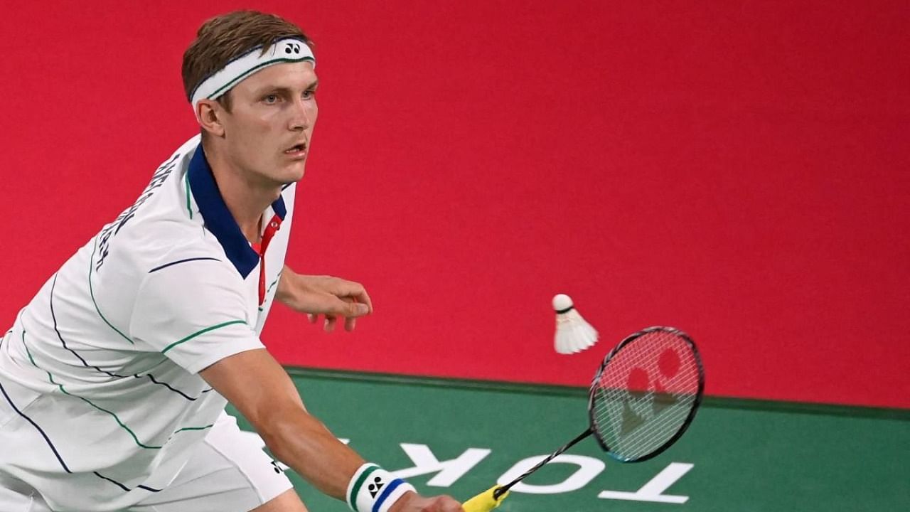 Denmark's Viktor Axelsen hits a shot in his men's singles badminton group stage match against Austria's Luka Wraber during the Tokyo 2020 Olympic Games at the Musashino Forest Sports Plaza in Tokyo on July 24, 2021. Credit: AFP Photo